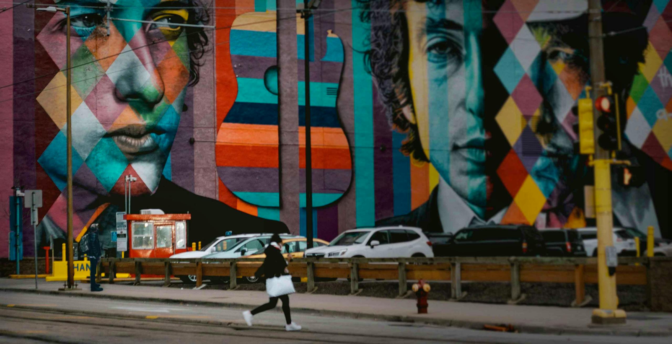 City street with mural of Bob Dylan