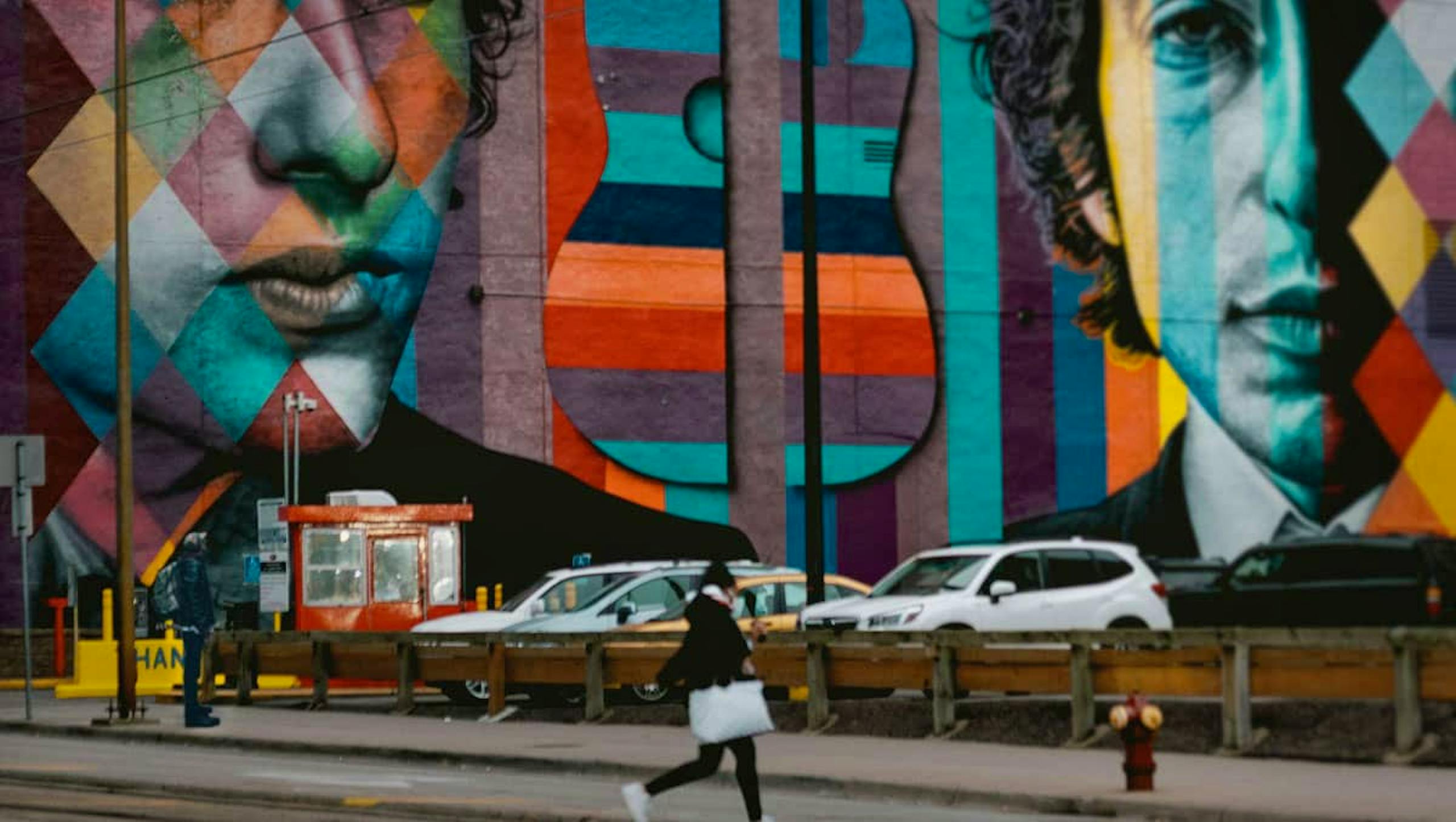 City street with mural of Bob Dylan