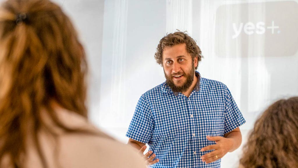 Man giving a talk for Massah in Israel