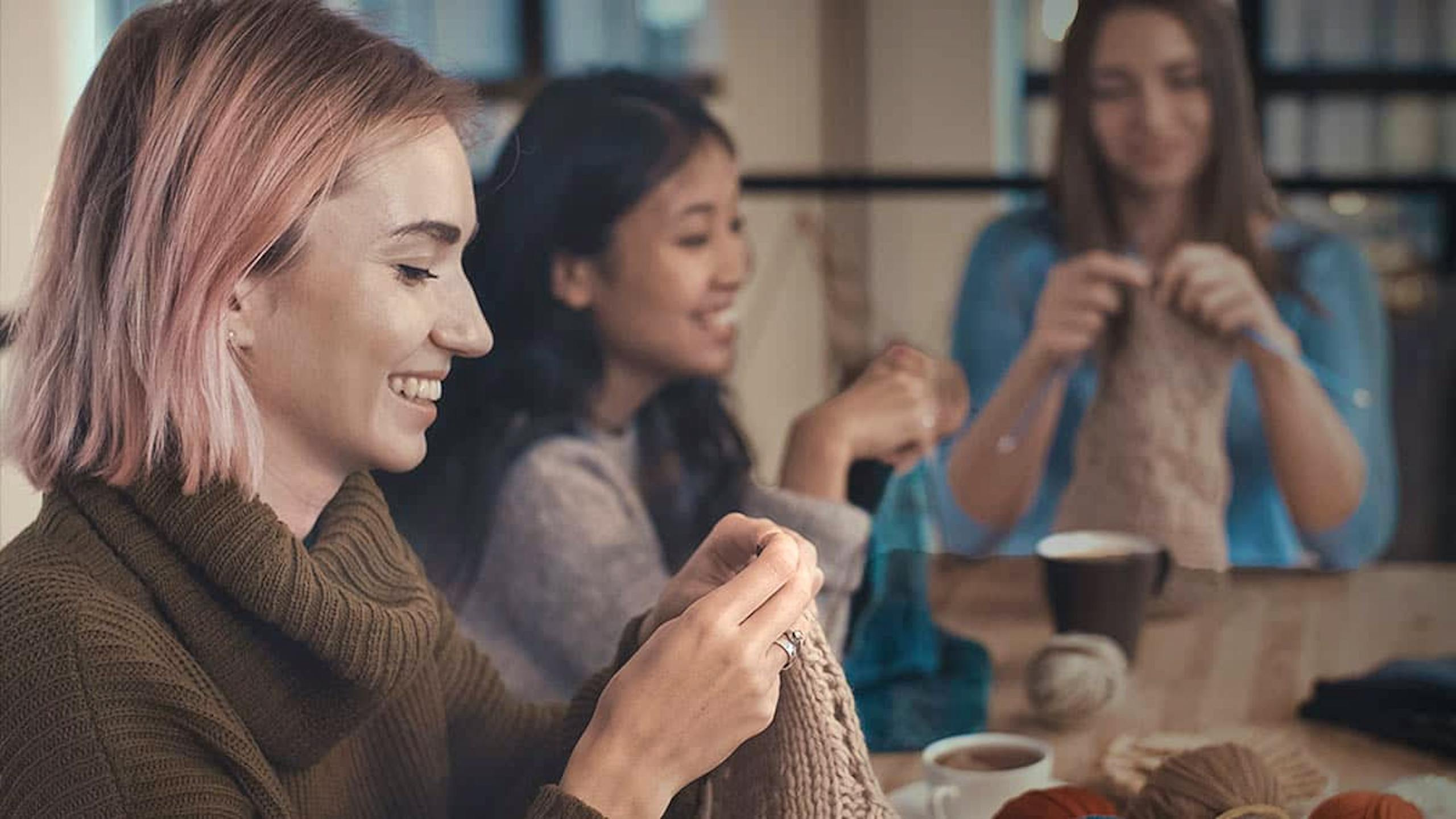 Friends knitting together