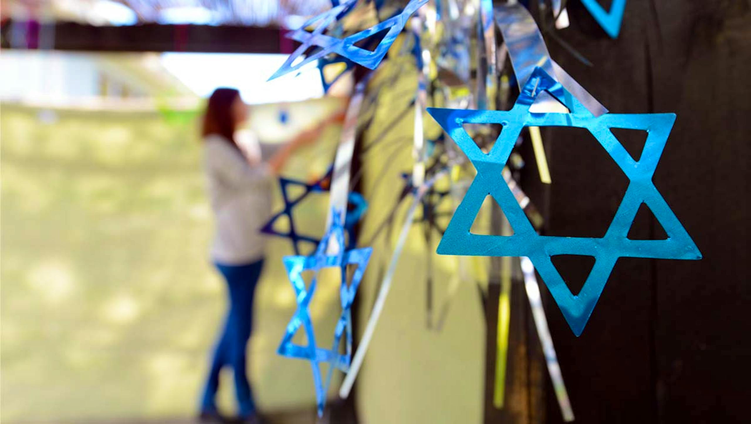 Woman decorating a sukkah