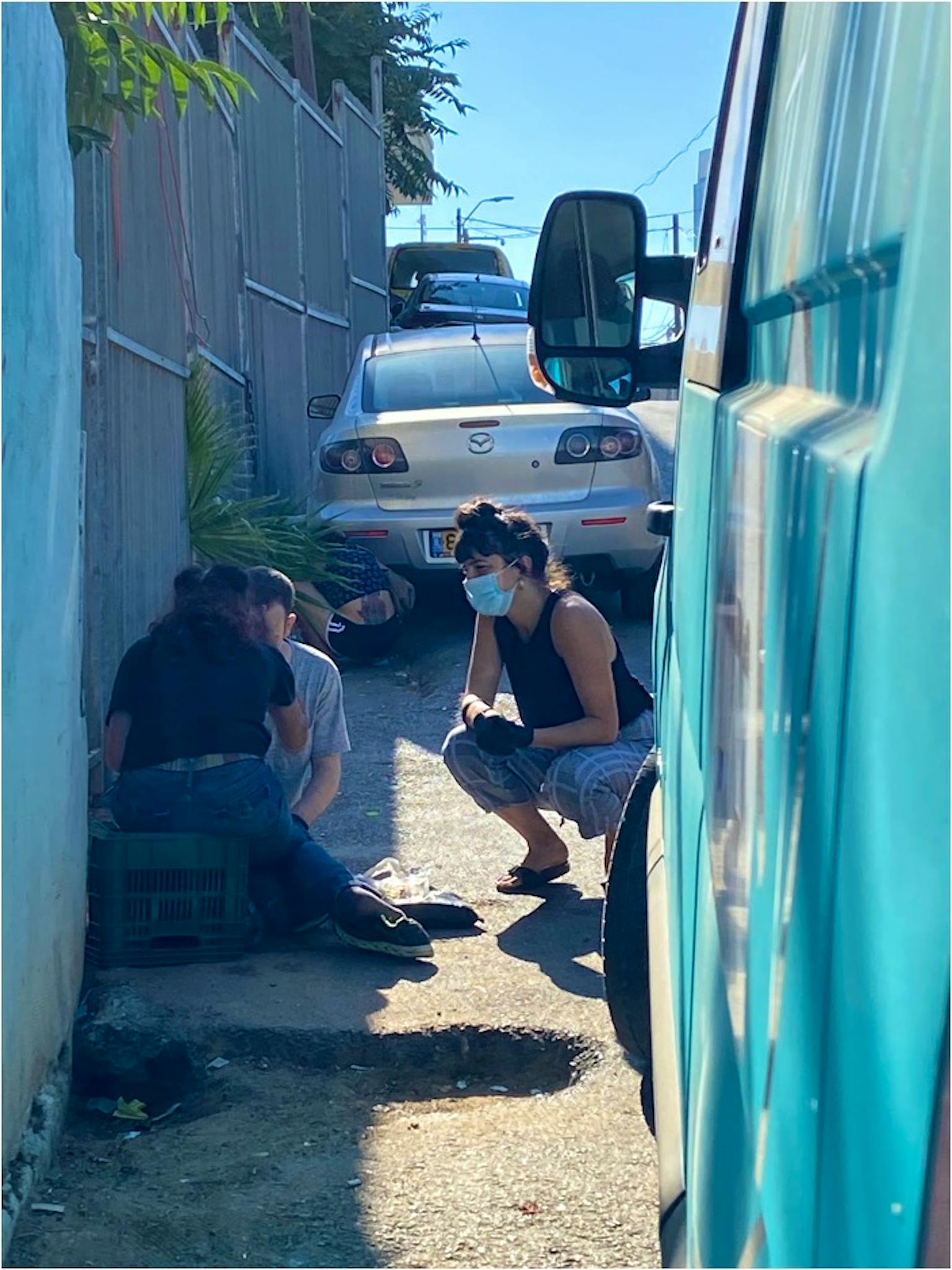 Maayan talks to people on the street.