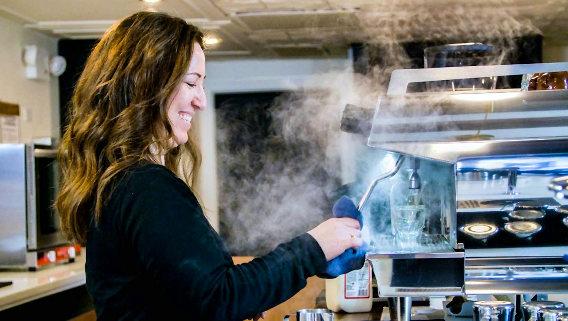 Sarah Levy behind the coffee bar at Moshava