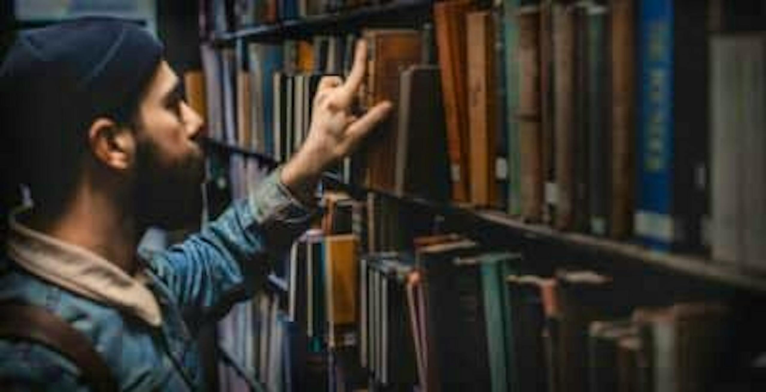 Jewish man searching in Library