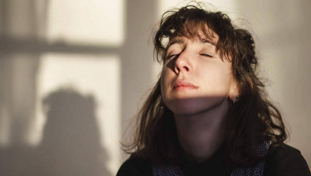 Young Jewish woman experiencing peace